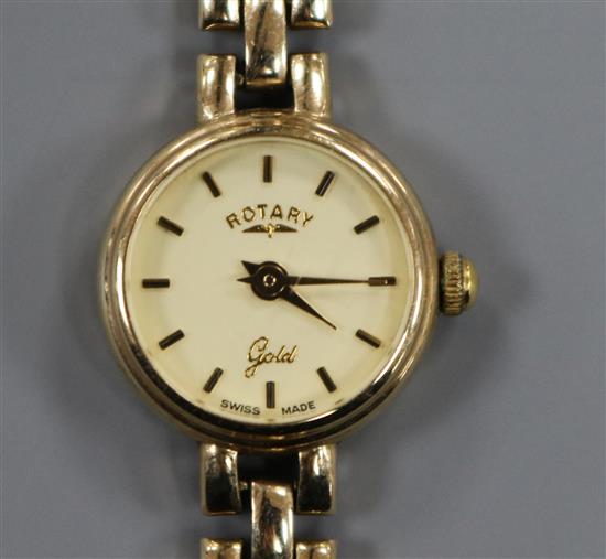 A ladys 9ct gold Rotary manual wind wrist watch, on a 9ct gold bracelet.